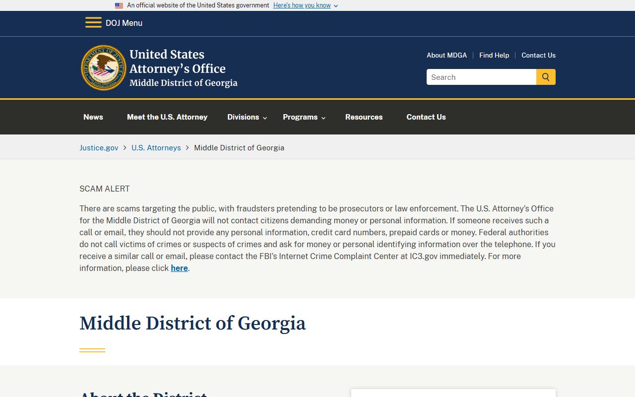 Macon County arrest records federal prosecutor distinction